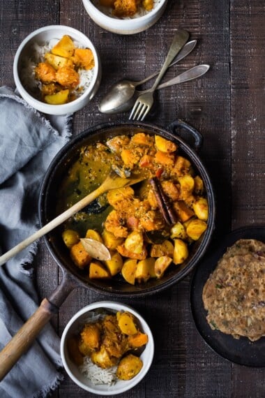 A soothing and comforting North Indian Butternut and Potato Curry hailing from Rajasthan, featuring winter squash and potatoes, using whole spices and ghee, served over fluffy basmati rice. | #pumpkincurry #potatocurry #aloo #butternutcurry #rajisthani #kaddu #curriedpotatoes #vegetarain #indianfood