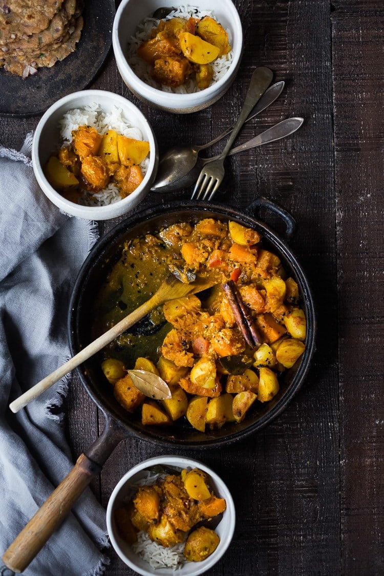 A soothing and comforting North Indian Butternut and Potato Curry hailing from Rajasthan, featuring winter squash and potatoes, using whole spices and ghee, served over fluffy basmati rice. | #pumpkincurry #potatocurry #aloo #butternutcurry #rajisthani #kaddu #curriedpotatoes #vegetarain #indianfood 