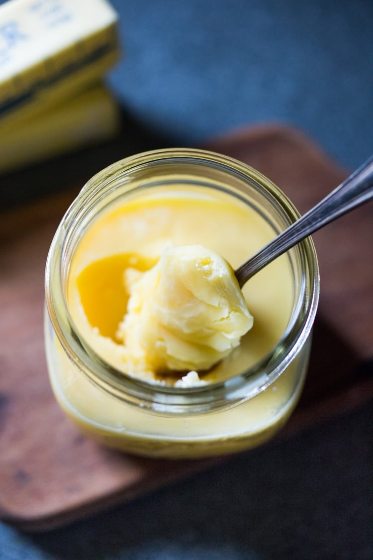 How to make ghee, a simple process that turns butter into the most flavorful foundation for authentic Indian cooking. Removing the milk solids out of butter makes it highly digestible, soothing to the body and according to Ayurvedic medicine, helps balance out the 3 doshas with many health benefits. #ghee #homemadeghee #gheebenifits #gheeuses #howtomakeghee #