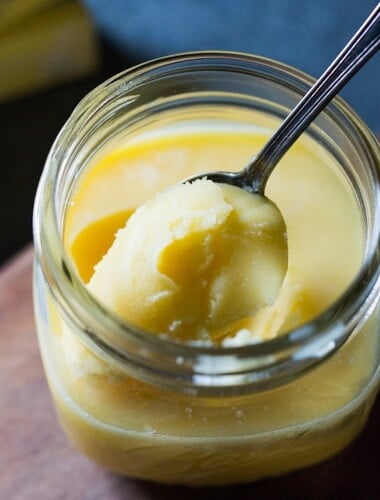 How to make ghee, a simple process that turns butter into the most flavorful foundation for authentic Indian cooking. Removing the milk solids out of butter makes it highly digestible, soothing to the body and according to Ayurvedic medicine, helps balance out the 3 doshas with many health benefits. #ghee #homemadeghee #gheebenifits #gheeuses #howtomakeghee #