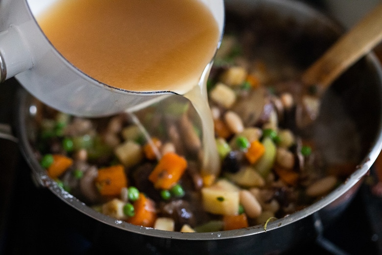 add broth to the pan