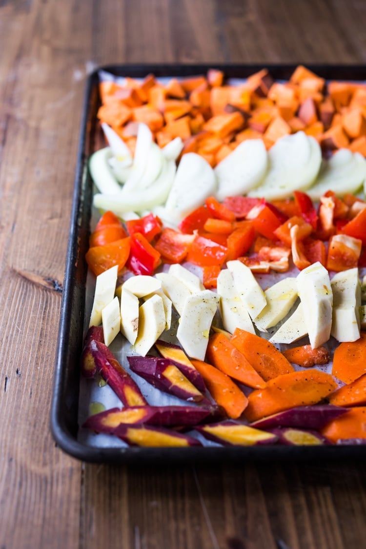 The secret to making Simple Roasted Veggies in the oven that come out perfect every time. Easy, healthy, delicious! Vegan and Gluten-free. #roastedveggies #roastedvegetables #bakedvegetables #vegan #healthy #veganside #glutenfree #feastingathome #sheetpanvegetables 