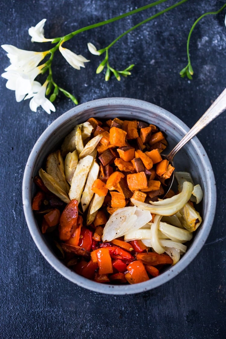 The secret to making Simple Roasted Veggies in the oven that come out perfect every time. Easy, healthy, delicious! Vegan and Gluten-free. #roastedveggies #roastedvegetables #bakedvegetables #vegan #healthy #veganside #glutenfree #feastingathome #sheetpanvegetables 