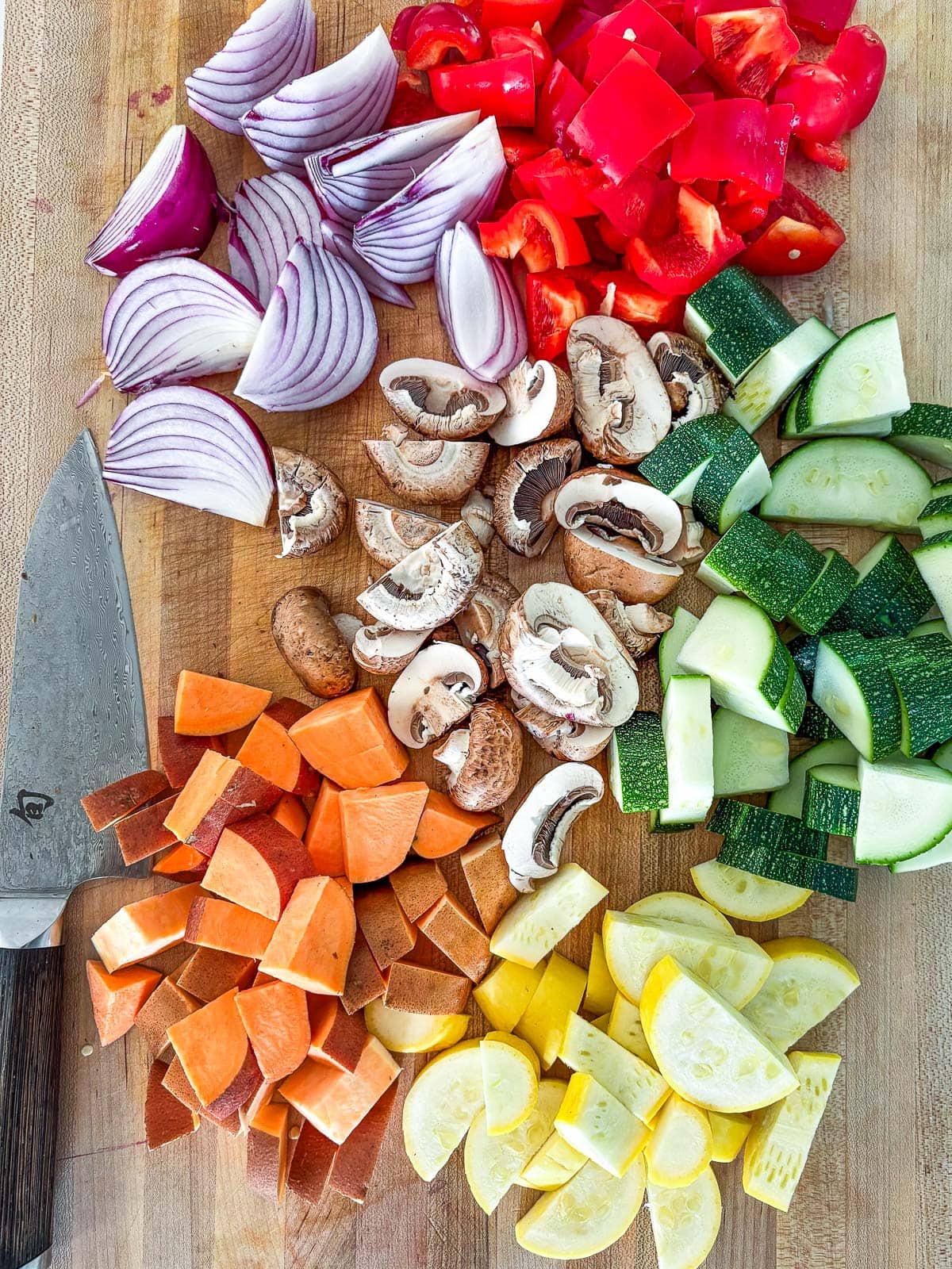 Chopping the vegetables into similar sizes.