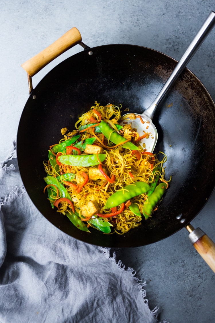 Singapore noodles— stir-fried rice noodles with curry, tofu and vegetables—a Chinese take out menu classic - easy recipe, vegetarian and full of authentic flavor! #meifun #singaporenoodles #currynoodles #chinesenoodles #stirfry #stirfrynoodles #vegetarian #noodles 