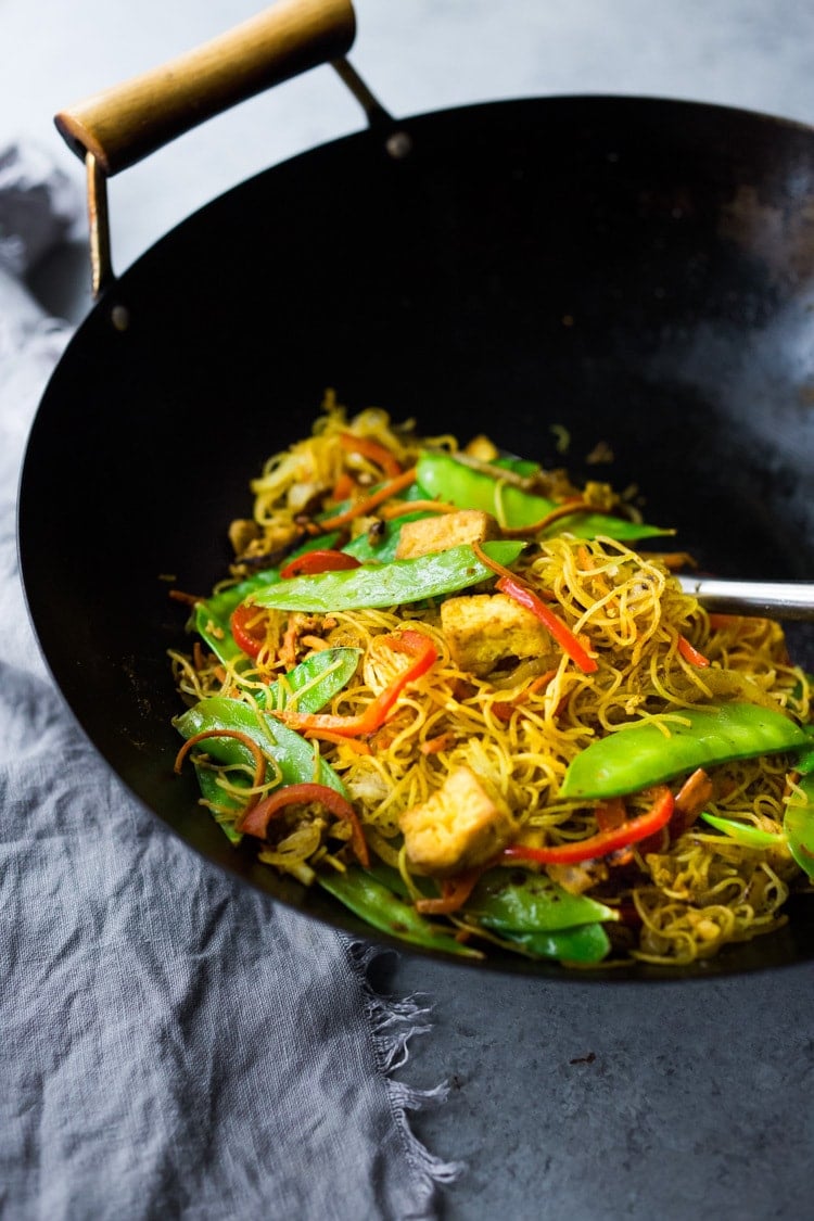 Singapore noodles— stir-fried rice noodles with curry, tofu and vegetables—a Chinese take out menu classic - easy recipe, vegetarian and full of authentic flavor! #meifun #singaporenoodles #currynoodles #chinesenoodles #stirfry #stirfrynoodles #vegetarian #noodles 