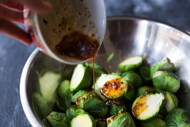 Sheet-Pan Szechuan Chicken (or Tofu) with Brussel Sprouts  takes only 15-20 minutes of hands on time before baking in the oven. A full-flavored weeknight dinner your whole family will love!  #sheetpandinner #szechuanchicken #szechuan #szechuansauce #sheetpanchicken #roastedbrusselsprouts