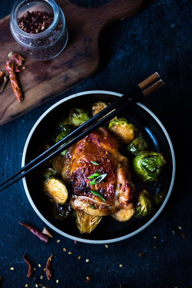 Sheet-Pan Szechuan Chicken (or Tofu) with Brussel Sprouts  takes only 15-20 minutes of hands on time before baking in the oven. A full-flavored weeknight dinner your whole family will love!  #sheetpandinner #szechuanchicken #szechuan #szechuansauce #sheetpanchicken #roastedbrusselsprouts