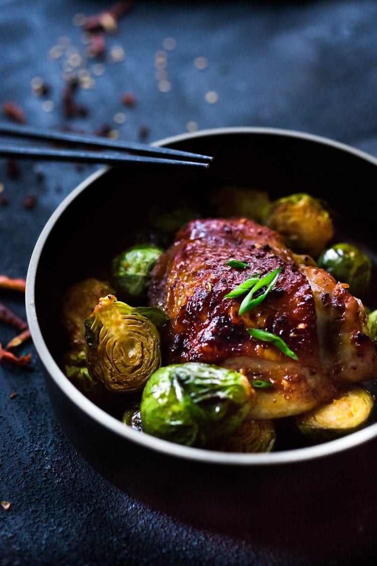 Sheet-Pan Szechuan Chicken (or Tofu) with Brussel Sprouts  takes only 15-20 minutes of hands on time before baking in the oven. A full-flavored weeknight dinner your whole family will love!  #sheetpandinner #szechuanchicken #szechuan #szechuansauce #sheetpanchicken #roastedbrusselsprouts