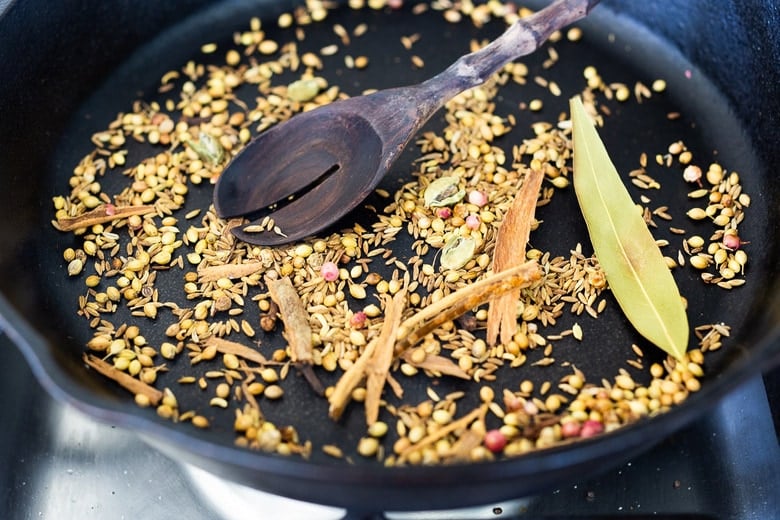 Garam Masala spices toasting in a pan 
