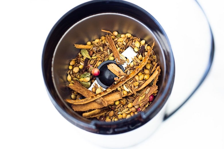 blending garam masala in a spice grinder