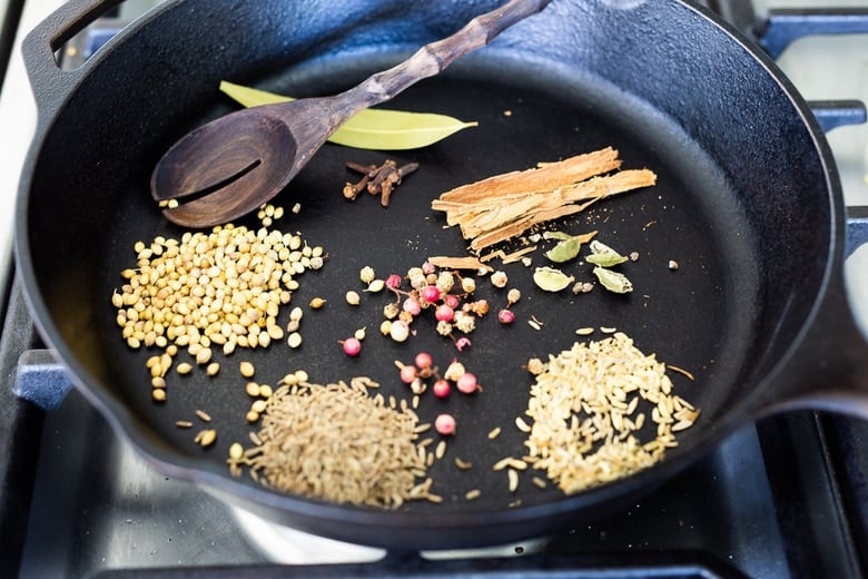 Garam Masala spices toasting in a pan.