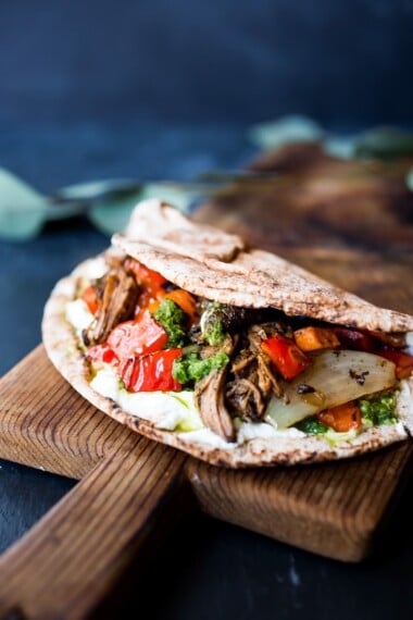 The best recipe for Lamb Shawarma- tender, juicy, leg of lamb, slow roasted in the oven with Middle Eastern Spices until falling apart. Serve this with rice and veggies, or in a pita or wrap! #lambrecipe #Shawarmarecipe #lambshawarmawrap #lambshawarma #fanoflamb #shawarma #authenticshawarma #