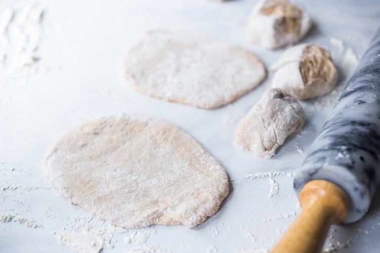 Quick EASY Homemade Naan Bread Recipe- a simple step by step guide to making Indian style- pillowy naan bread in a skillet with all your favorite variations- garlic naan, onion naan and seeded naan! #feastingathome #naan #naanbread #indianfood #wholewheatnaan #garlicnaan #onionnaan #indianbread #indianrecipes