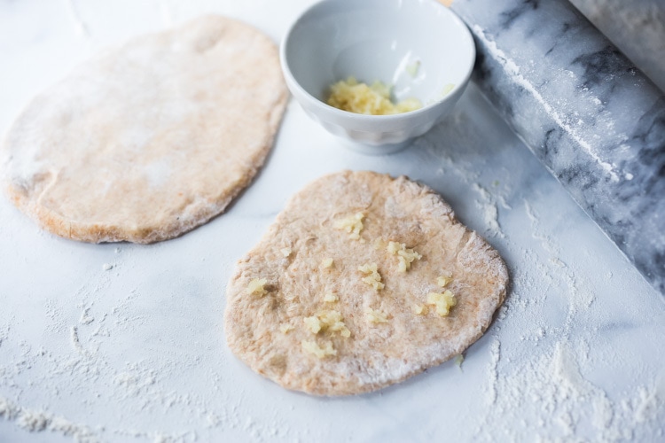 Quick EASY Homemade Naan Bread Recipe- a simple step by step guide to making Indian style- pillowy naan bread in a skillet with all your favorite variations- garlic naan, onion naan and seeded naan! #feastingathome #naan #naanbread #indianfood #wholewheatnaan #garlicnaan #onionnaan #indianbread #indianrecipes