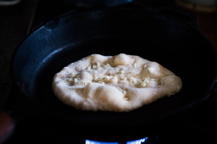 Quick EASY Homemade Naan Bread Recipe- a simple step by step guide to making Indian style- pillowy naan bread in a skillet with all your favorite variations- garlic naan, onion naan and seeded naan! #feastingathome #naan #naanbread #indianfood #wholewheatnaan #garlicnaan #onionnaan #indianbread #indianrecipes