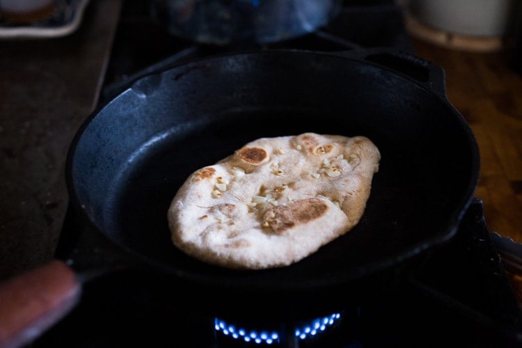 Quick EASY Homemade Naan Bread Recipe- a simple step by step guide to making Indian style- pillowy naan bread in a skillet with all your favorite variations- garlic naan, onion naan and seeded naan! #feastingathome #naan #naanbread #indianfood #wholewheatnaan #garlicnaan #onionnaan #indianbread #indianrecipes