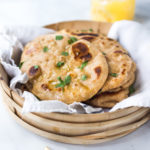 Quick EASY Homemade Naan Bread Recipe- a simple step by step guide to making Indian style- pillowy naan bread in a skillet with all your favorite variations- garlic naan, onion naan and seeded naan! #feastingathome #naan #naanbread #indianfood #wholewheatnaan #garlicnaan #onionnaan #indianbread #indianrecipes
