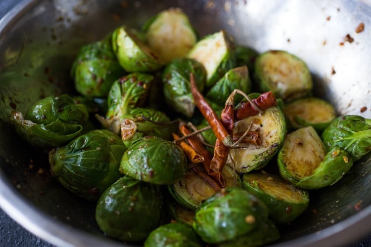 Sheet-Pan Szechuan Chicken (or Tofu) with Brussel Sprouts  takes only 15-20 minutes of hands on time before baking in the oven. A full-flavored weeknight dinner your whole family will love!  #sheetpandinner #szechuanchicken #szechuan #szechuansauce #sheetpanchicken #roastedbrusselsprouts