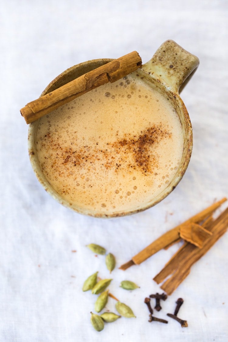 Masala Chai in a mug with a cinnamon stick 