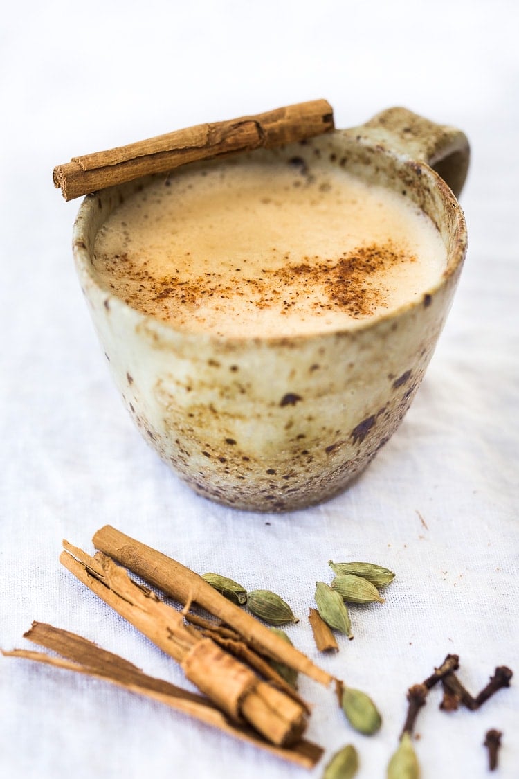How to make delicious authentic Masala Chai, like they do in India, using using whole spices. Vegan and Sugar Free adaptable. #chai #chaitea #masalachai #howtomakechai #masala