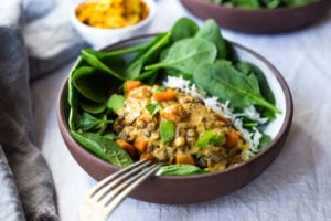 This Creamy Coconut Lentil Curry can be made in an Instant Pot or on the stove top. Infused with fragrant Indian spices, this recipe is not only delicious, it is is vegan and gluten free! #currylentils #indianlentils #lentilcurry #veganlentilcurry #instantpot #vegan #vegancurry #veganlentils #eatclean #cleaneating #plantbased