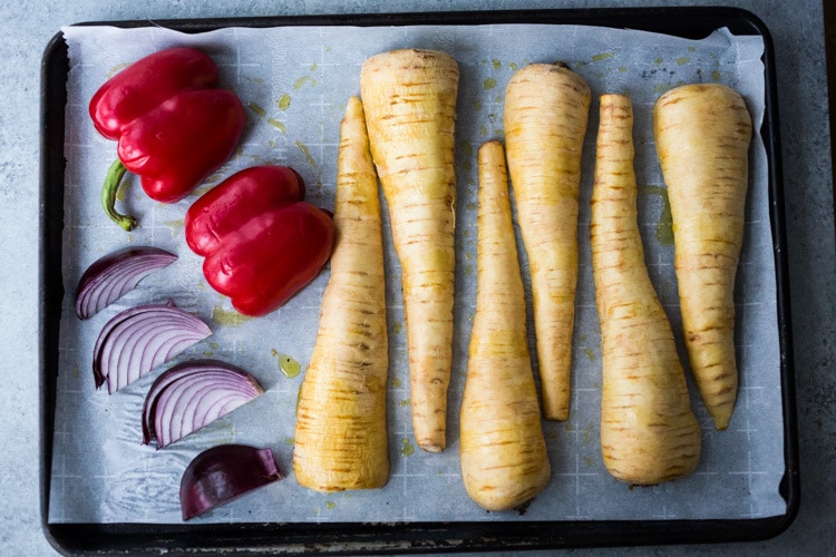 Roasted Parsnips with Romesco Sauce, a simple vegan side dish that is perfect for weeknight dinners or the holiday table! #vegan #veganside #sidedish #healthyside #parsnips #parsniprecipe #roastedparships