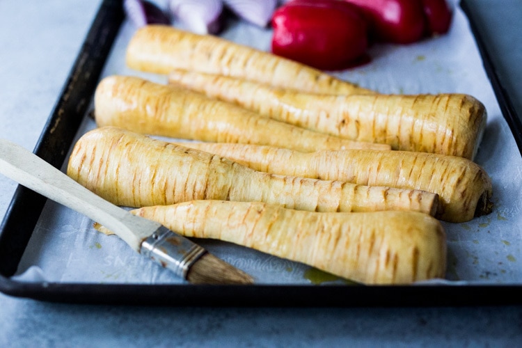 Roasted Parsnips with Romesco Sauce, a simple vegan side dish that is perfect for weeknight dinners or the holiday table! #vegan #veganside #sidedish #healthyside #parsnips #parsniprecipe #roastedparships