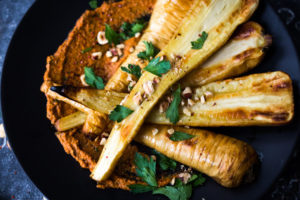 Roasted Parsnips with Romesco Sauce, a simple vegan side dish that is perfect for weeknight dinners or the holiday table! #vegan #veganside #sidedish #healthyside #parsnips #parsniprecipe #roastedparships