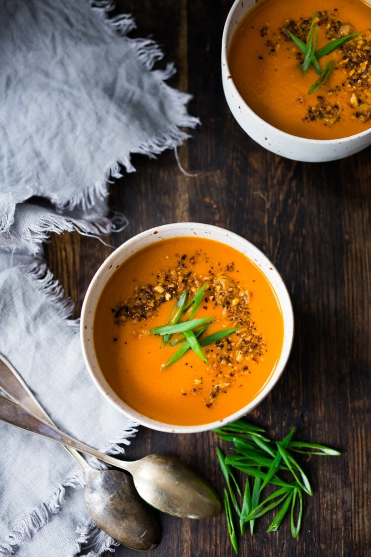 15 Minute Tomato Soup with Coconut and Ginger- a quick vegan tomato soup made with simple pantry ingredients. #vegansoup #tomatosoup #cleaneating #eatclean #veganrecipes #heatlhytomatosoup #quickrecipes #coconutsoup #plantbased #detox 