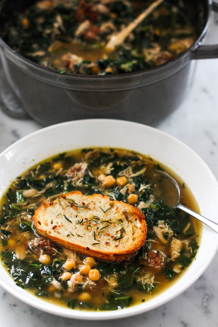 Kale, Chickpea and Chicken soup with a toasty rosemary crouton. Simple and delicious. #chickensoup #kale #chickpeasoup | www.feastingathome.com