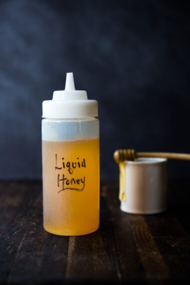 How to make Honey Simple Syrup - an easy way to revive old honey or keep honey loose and liquid so it's easy to pour and mix into vinaigrettes, marinades and drinks! #honeysimplesyrup #liquidhoney #honey #alternativesweetener #eatingclean #cleaneating #eatclean