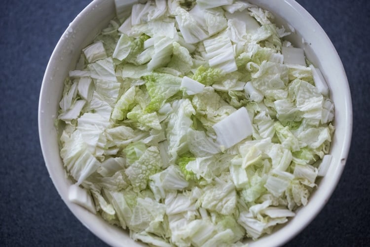 Cover the salted cabbage with water.