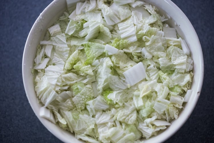 Cover the salted cabbage with water. 