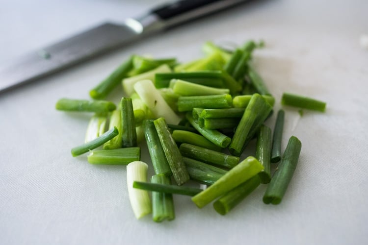 slicing the green onions.