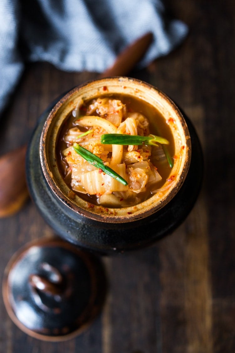 How to make Kimchi that only takes 30 minutes of hands-on-time before mother nature takes over! Full of healthy, gut-healing probiotics, this authentic kimchi recipe is vegan adaptable & gluten free. Quick and easy, make it as spicy or mild as you like. #kimchi #howtomakekimchi #vegan #vegankimchi #eatclean #cleaneating #plantbased #napa cabbage #kimchirecipe #probiotics #fermented #guthealing #fermentedcabbage #koreanfood #koreanrecipe