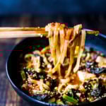 A simple easy recipe for Kimchi Soup- this version is vegan, made with shiitake mushrooms, silken tofu and kale. Serve over rice or noodles! Delicious Korean flavor! #kimchisoup #easykimchisoup #vegankimchisoup #plantbased #cleaneating #eatclean #vegansoup #koreansoup