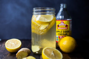 How to make a switchel- a healthy, energizing, probiotic drink made with apple cider vinegar (with the "mother" in it), lemon, ginger, honey or maple syrup- that builds healthy bacteria in the gut, lowers cholesterol, helps sheds weight, boosts immunity, aids with digestion and regularity and increases energy and vitality!  #switchel #switzel #probiotics #guthealth #healthydrinks #healthygut #healthybacteria #detox #cleaneating #eatclean #applecidervinegar #drink #water #ginger