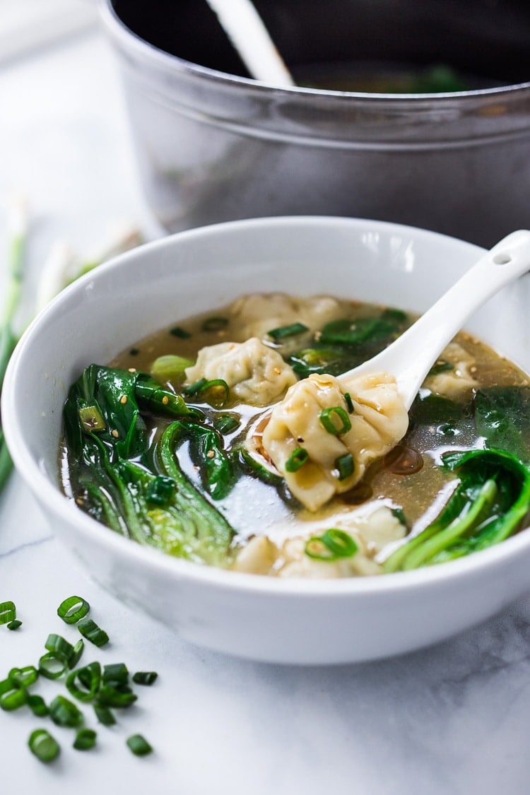 15 Minute Wonton Soup with Lemon Ginger Broth-loaded up with healthy vibrant greens - a fast and easy weeknight diner! #wontonsoup #broth #brothbased #brothysoup 