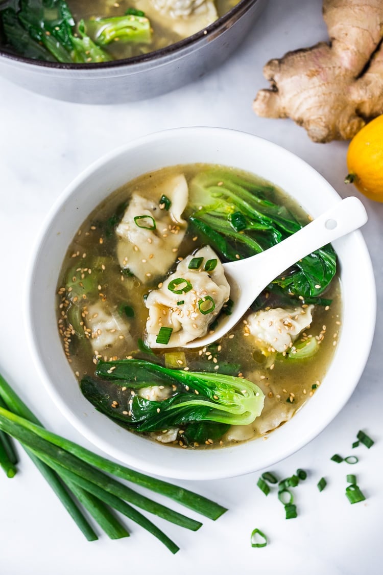 15 Minute Wonton Soup with Lemon Ginger Broth-loaded up with healthy vibrant greens - a fast and easy weeknight diner! #wontonsoup #broth #brothbased #brothysoup 
