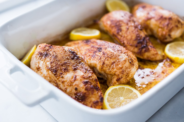 Baked Chicken Breasts- a simple easy recipe for perfectly juicy and flavorful chicken breast, roasted in the oven. #chickenbreast #bakedchicken #easychicken #chickenrecipes #roastedchicken 