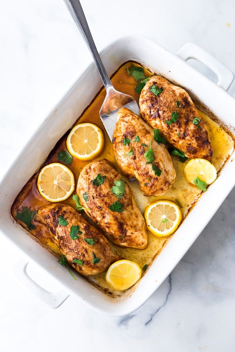 Baked Chicken Breasts- a simple easy recipe for perfectly juicy and flavorful chicken breast, roasted in the oven. #chickenbreast #bakedchicken #easychicken #chickenrecipes #roastedchicken