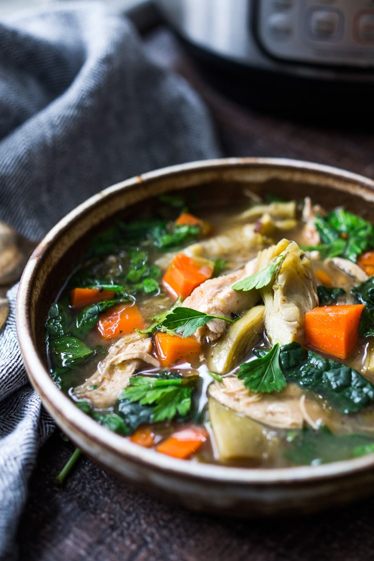 Instant Pot Chicken Artichoke Soup with Wild Rice - a light, healthy and brothy soup with vegetables, wild rice and artichoke hearts with only 15 minutes of hands on time! A quick and easy dinner recipe! Keto friendly! #chickensoup #chickenwildricesoup #instantpotrecipe #instantpotsouprecipe #brothbasedsoup #artichokesoup #easysoup #easydinner #ketosoup