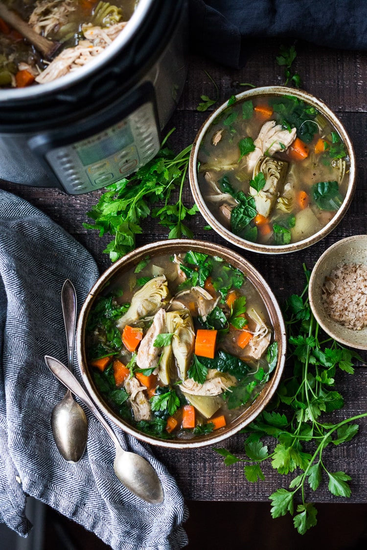 Instant Pot Chicken Artichoke Soup with Wild Rice - a light, healthy and brothy soup with vegetables, wild rice and artichoke hearts with only 15 minutes of hands on time! A quick and easy dinner recipe! Keto friendly! #chickensoup #chickenwildricesoup #instantpotrecipe #instantpotsouprecipe #brothbasedsoup #artichokesoup #easysoup #easydinner #ketosoup