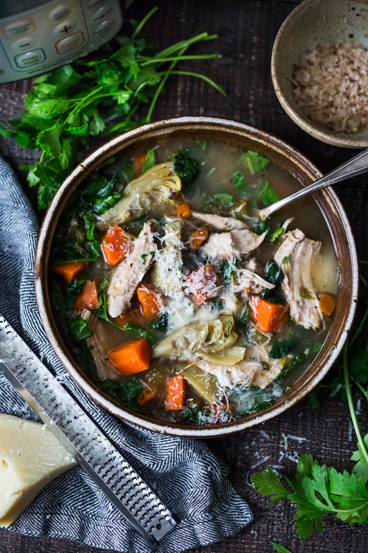 Instant Pot Chicken Artichoke Soup with Wild Rice - a light, healthy and brothy soup with vegetables, wild rice and artichoke hearts with only 15 minutes of hands on time! A quick and easy dinner recipe! Keto friendly! #chickensoup #chickenwildricesoup #instantpotrecipe #instantpotsouprecipe #brothbasedsoup #artichokesoup #easysoup #easydinner #ketosoup