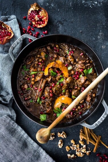 A delicious recipe for Fesenjan, a Persian Walnut Pomegranate Stew with chicken and chickpeas. Earthy, rich and tangy, this is bursting with Middle Eastern Flavor! #persianstew #fesenjan #persianrecipes #persiancchicken #middleeastern #chicken #chickpeastew