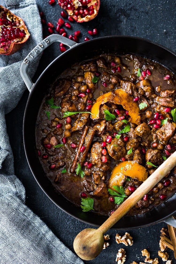 A delicious recipe for Fesenjan, a Persian Walnut Pomegranate Stew with chicken and chickpeas. Earthy, rich and tangy, this is bursting with Middle Eastern Flavor! #persianstew #fesenjan #persianrecipes #persiancchicken #middleeastern #chicken #chickpeastew