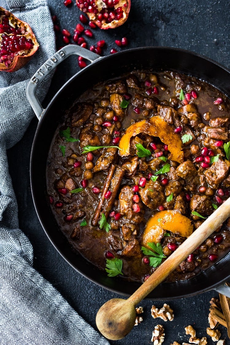 A delicious recipe for Fesenjan, a Persian Walnut Pomegranate Stew with chicken and chickpeas. Earthy, rich and tangy, this is bursting with Middle Eastern Flavor! #persianstew #fesenjan #persianrecipes #persiancchicken #middleeastern #chicken #chickpeastew