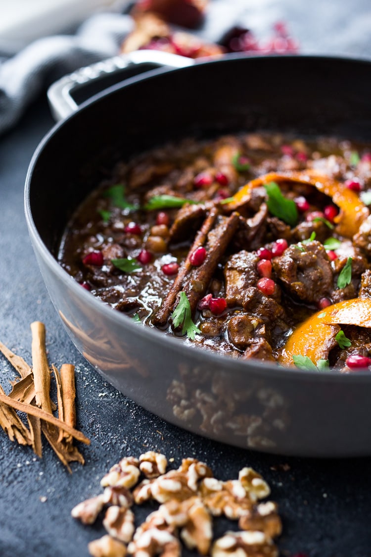 A delicious recipe for Fesenjan, a Persian Walnut Pomegranate Stew with chicken and chickpeas. Earthy, rich and tangy, this is bursting with Middle Eastern Flavor! #persianstew #fesenjan #persianrecipes #persiancchicken #middleeastern #chicken #chickpeastew 