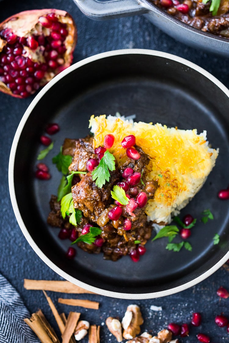 A delicious recipe for Fesenjan, a Persian Walnut Pomegranate Stew with chicken and chickpeas. Earthy, rich and tangy, this is bursting with Middle Eastern Flavor! #persianstew #fesenjan #persianrecipes #persiancchicken #middleeastern #chicken #chickpeastew 